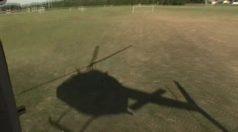 Shadow of helicopter taking off from the air Stock Footage 41082843