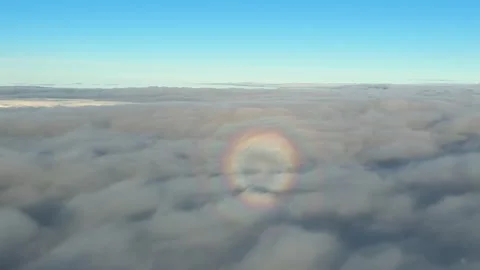 Shadow of a Jet Airplane Inside a Full Rainbow (Anthelion Visual Effect) on an Stock Footage 328083571