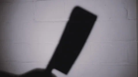 Shadow of killer with cleaver Stock Footage 35275663