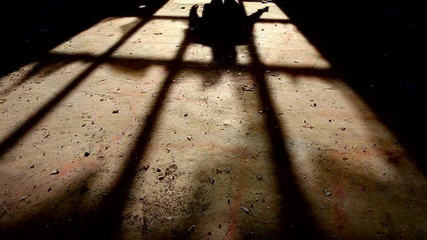 Shadow of a killer with a gun in his hand walking away Stock Footage 82761791