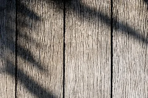 The shadow of leaf on a wooden surface Stock Photos