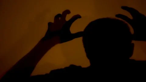 Shadow of madman showing terrible and evil actions, psychiatric hospital Stock Footage 82904071