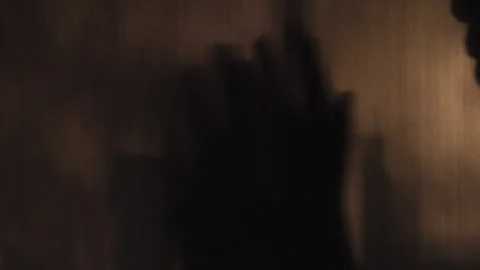 Shadow of male's hand gesture of refusal in fear Stock Footage 141916698