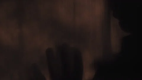 Shadow of male's hand gesture of refusal in fear Stock Footage 141963192