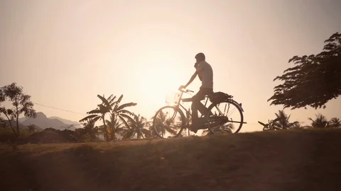 Shadow of a man on a bike in India Stock Footage 87915095
