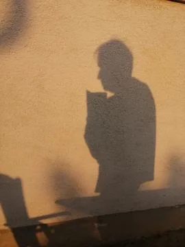 Shadow man  with book Stock Photos
