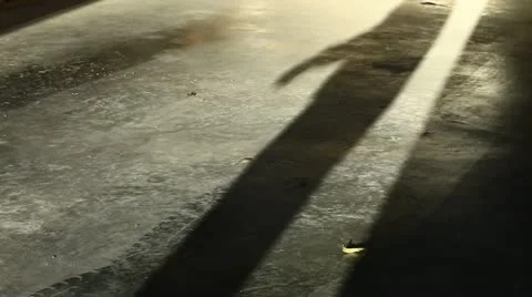 Shadow of a Man Closes a Garage Door Then Opens it Stock Footage 20548838