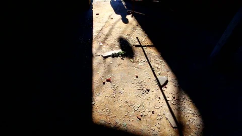 Shadow of a man entering spooky, abandoned building Stock Footage