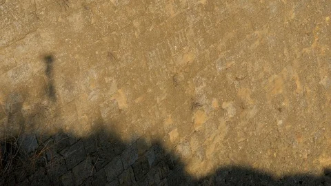 Shadow of man on the fortress wall 2 Stock Footage 126977272