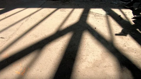Shadow of a man with gun sneaking in spooky, abandoned building Stock Footage 88333258