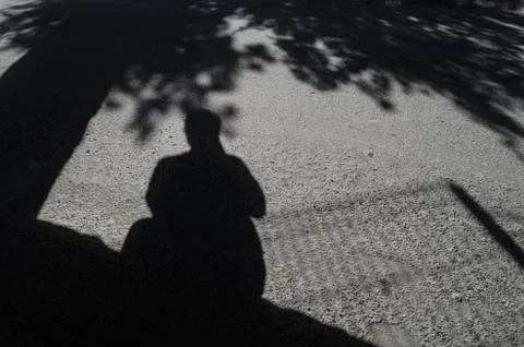 The shadow of a man holding a camera, self-portrait of a tourist photographer Stock Photos