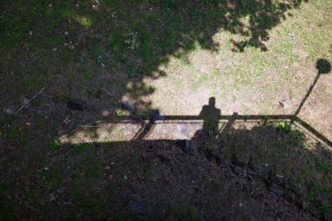Shadow of man looking from above Stock Photos