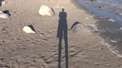 Shadow of a man morning time on a river bank Stock Footage 52679071