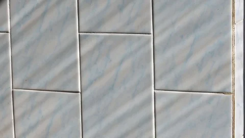 Shadow of a man is moving on the wall. Blue background. Stock Footage 76047943