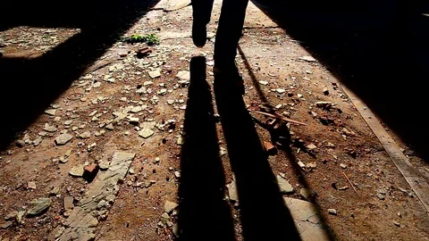 Shadow of a man opens door and enter some dark, spooky building 動画素材 82793520