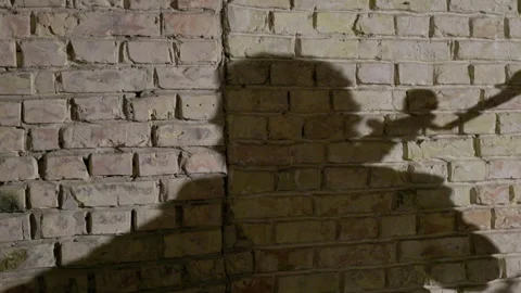 A shadow of a man playing cello. Stock Footage 273809798