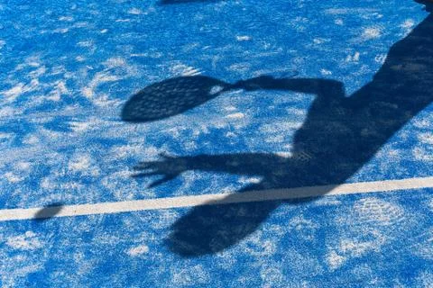 Shadow of a man playing paddle on the paddle court Stock Photos