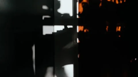 Shadow of a man pouring a drink from a teapot into a cup. Silhouette of a man Stock Footage 146382838