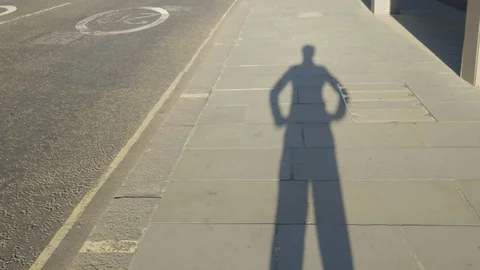 A shadow of a man putting his hands on his hips POV Stock Footage 95301764