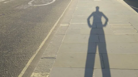 A shadow of a man putting his hands on his hips POV Video stock 95302279