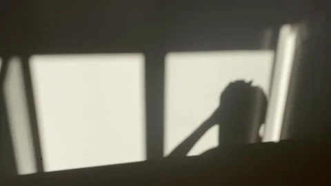 Shadow of a man raising his hands Stock Footage 302879820