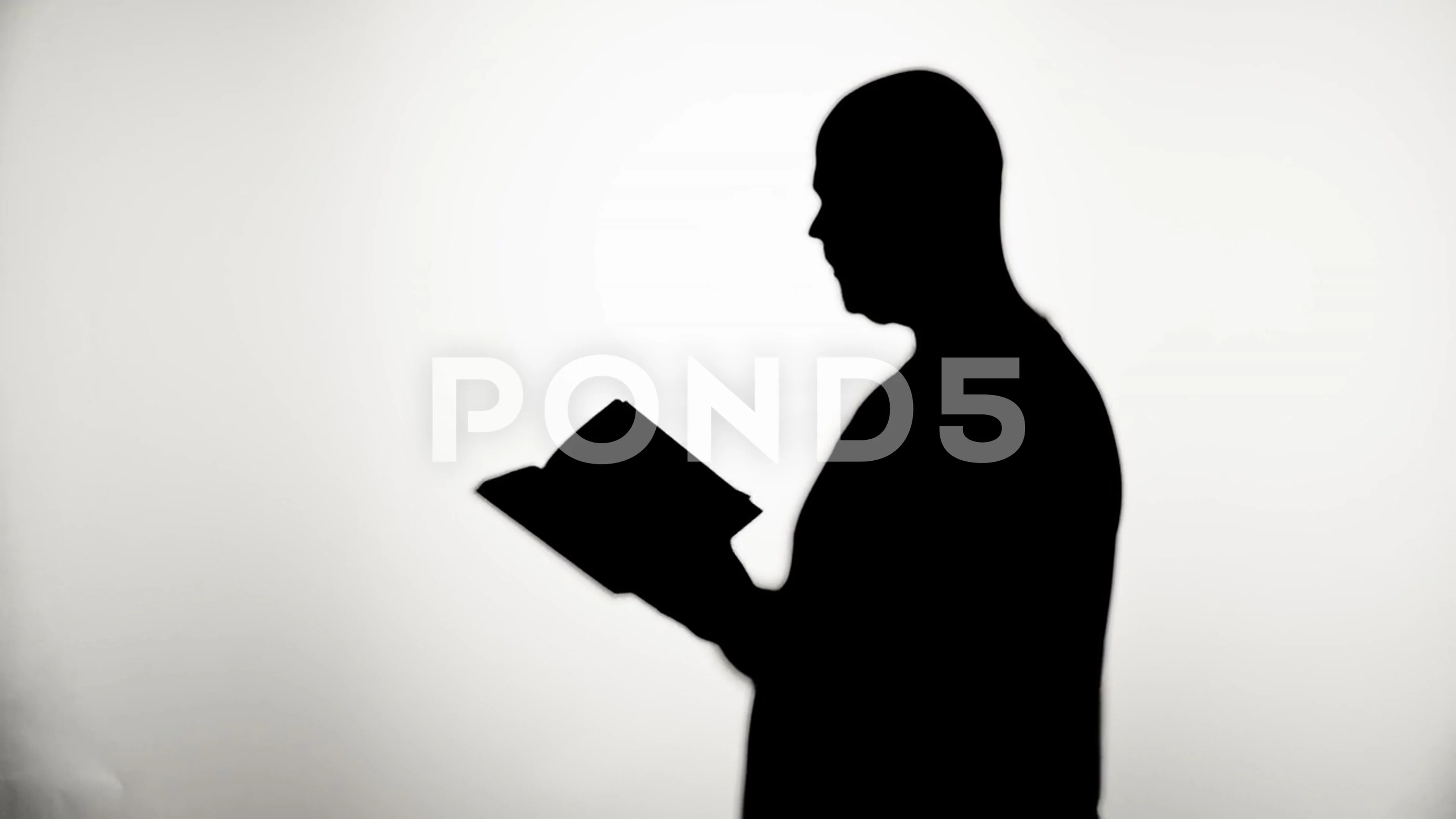 man reading silhouette
