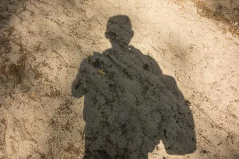 Shadow of man on send track pathway in forest. Concept of active lifestyle, t 스톡 사진