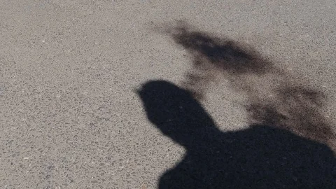 SHADOW OF MAN VAPING Stock Footage 95825639