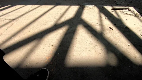 Shadow of a man walking away in spooky, abandoned building Stock Footage 88260668
