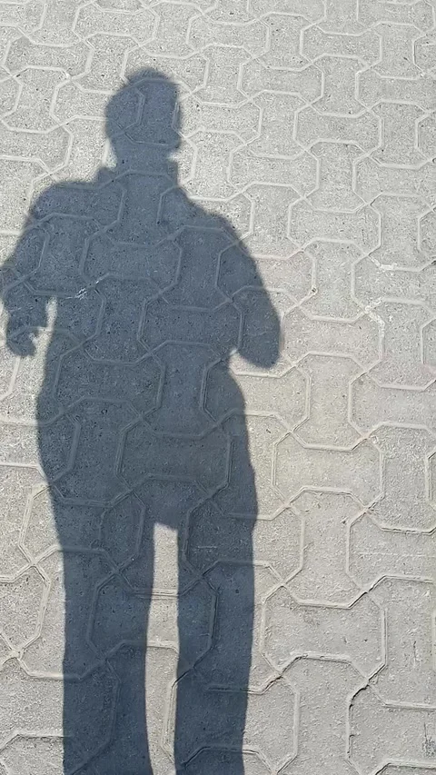 Shadow of the man walking Stock Footage 159366748