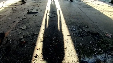 Shadow of a man walks out dark room Stock Footage 121227336