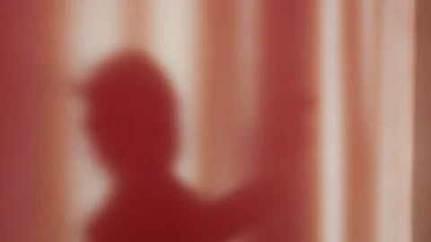 Shadow of a man on the wall, silhouette of a dancing girl. Stock Footage 146262358
