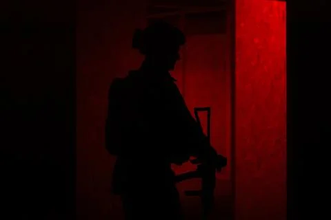 Shadow of a man with a weapon Stock Photos