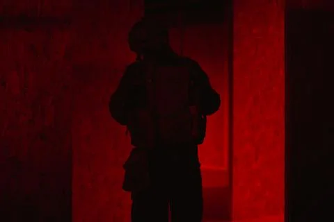 Shadow of a man with a weapon in the twilight Stock Photos