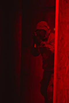 Shadow of a man with a weapon in the twilight Stock Photos