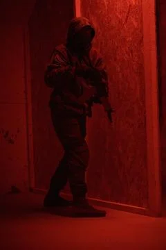 Shadow of a man with a weapon in the twilight Stock Photos