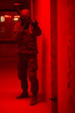 Shadow of a man with a weapon in the twilight Stock Photos