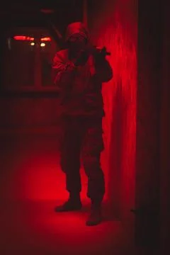 Shadow of a man with a weapon in the twilight Stock Photos