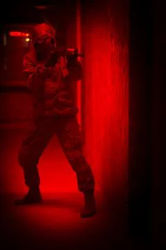 Shadow of a man with a weapon in the twilight Stock Photos