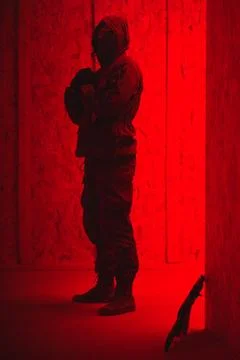 Shadow of a man with a weapon in the twilight Stock Photos