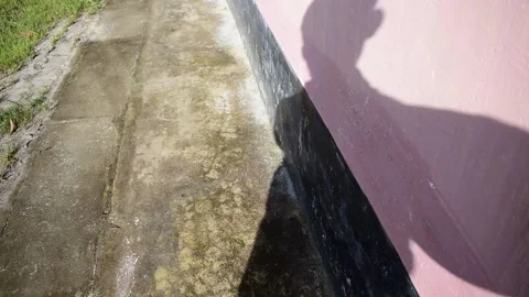 A shadow of a man while walking on a sunny day Stock Footage 137655938