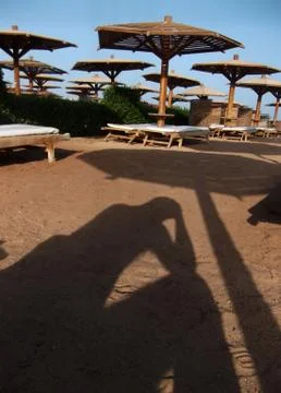 The shadow of a man who has problems on vacation. Stock Photos