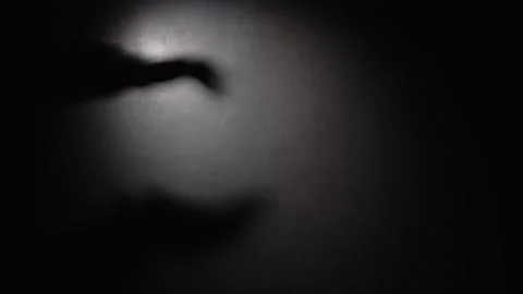 Shadow of a man's clapping hands Video stock 321125226