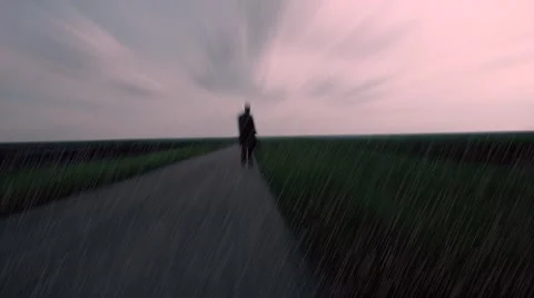 Shadow of men walking on the empty road ,walking with bag , looking for new life Stock Footage 51130662