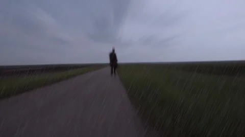 Shadow of men walking on the empty road ,walking with bag , looking for new life Stock Footage 51130690