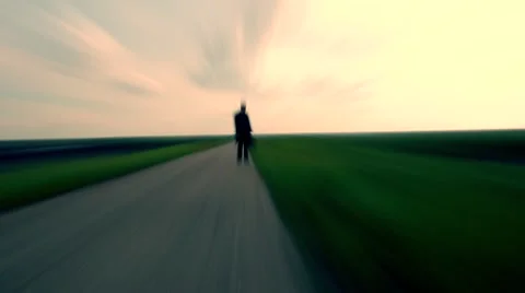 Shadow of men walking on the empty road ,walking with bag , looking for new life Stock Footage 51130733