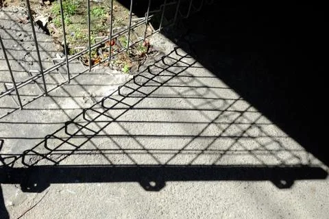 Shadow of Metal Gate. Stock Photos