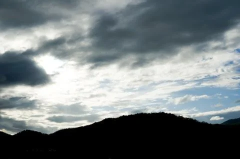Shadow of the mountain and raincloud Stock Photos