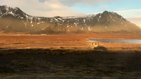 Shadow of moving car in open field in Iceland Stock Footage