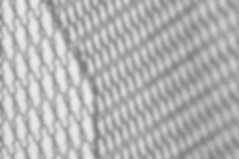 Shadow of Net on White Concrete Wall Background. Stock Photos